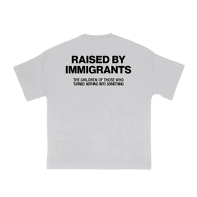 "Raised by Immigrants" Statement Tee