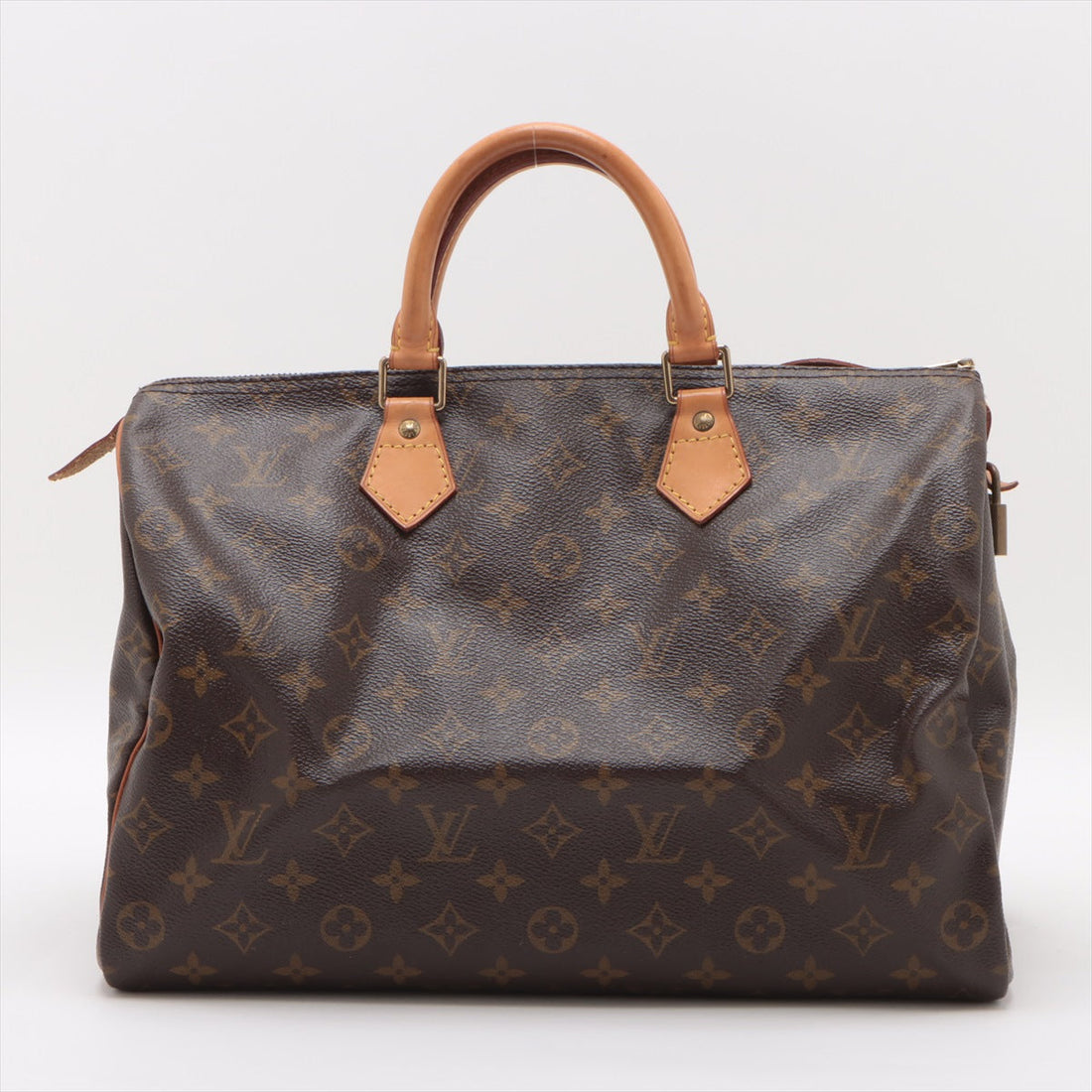 Authentic Louis Vuitton Speedy 35 Monogram Canvas, close-up of leather handles and brass hardware