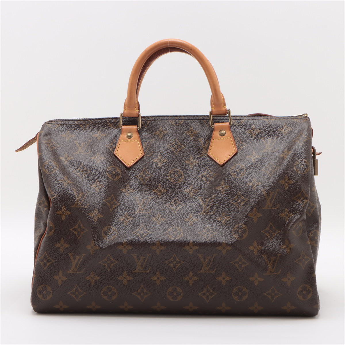 Authentic Louis Vuitton Speedy 35 Monogram Canvas, close-up of leather handles and brass hardware