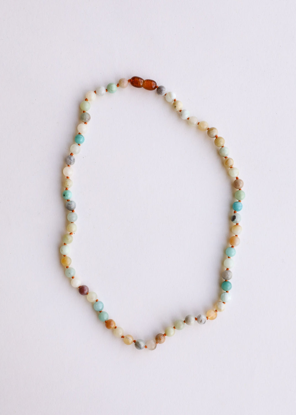 CanyonLeaf Natural Amazonite Gemstone || Beaded Necklace — CanyonLeaf branding close-up