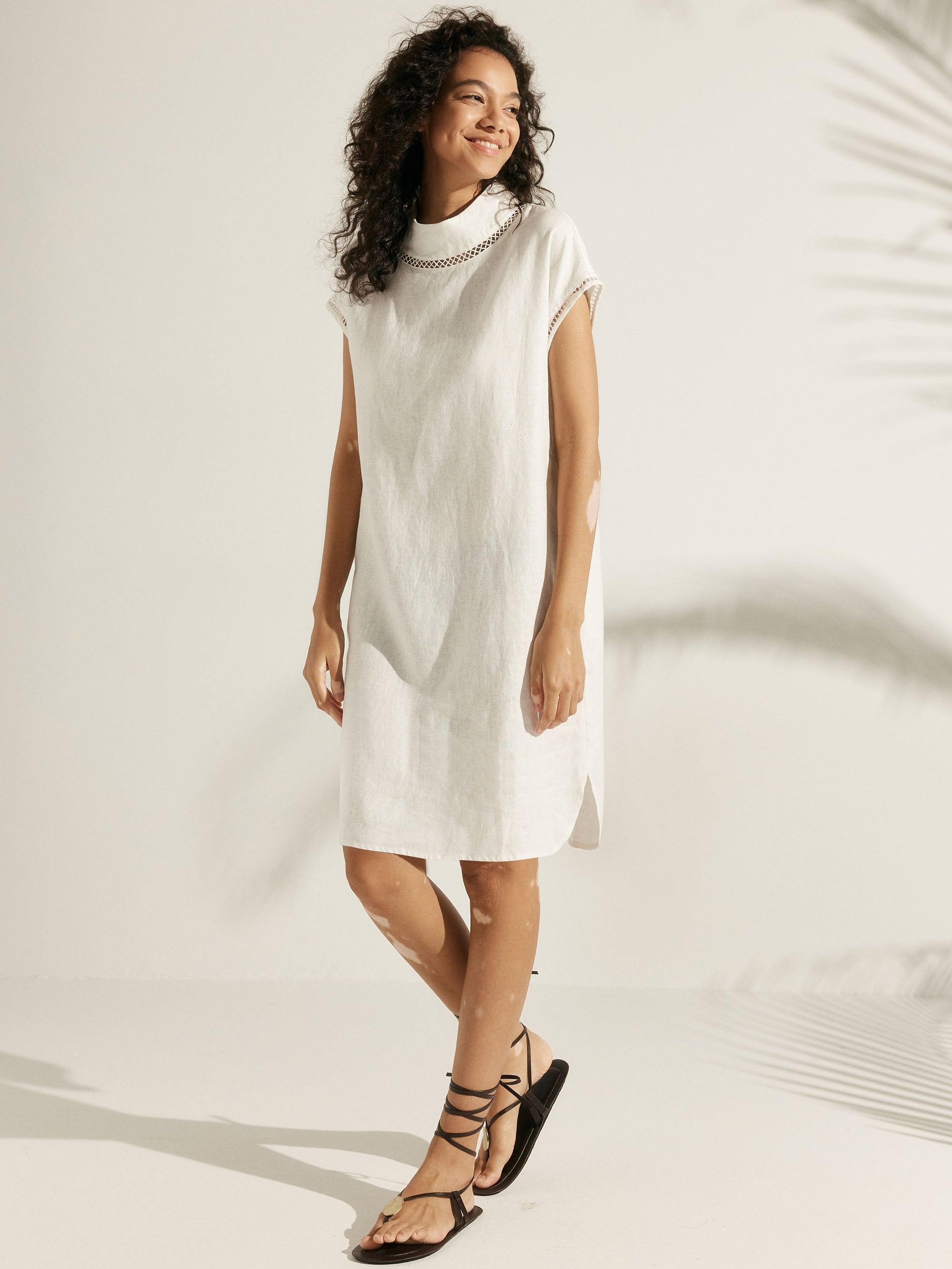 LINTICO LINTICO 100% Linen Cutout Turtleneck Mini Dress ZAHRA — LINTICO branding close-up