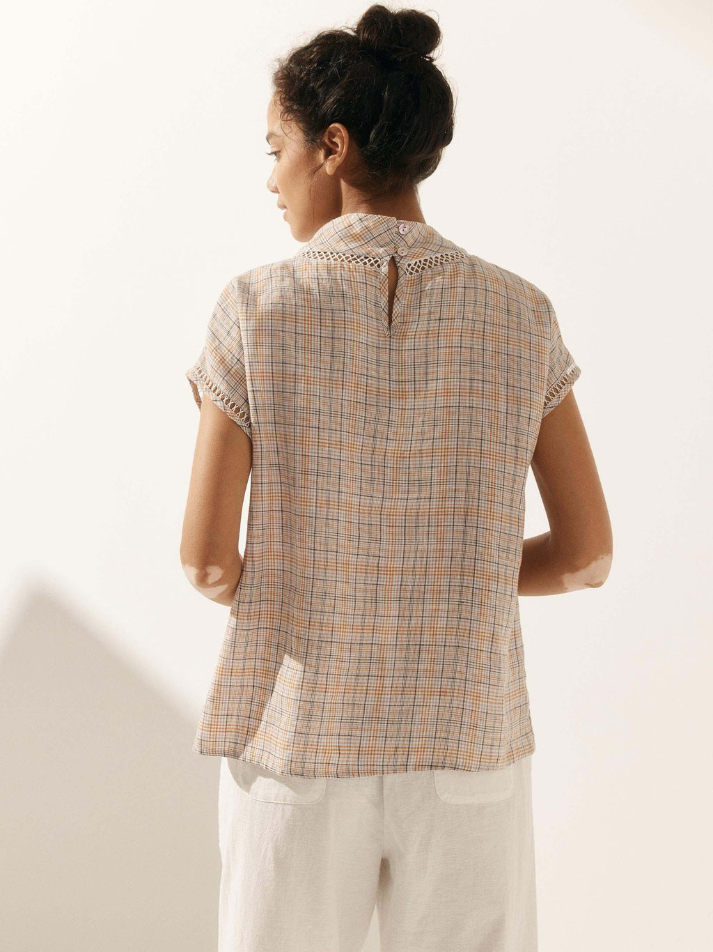 LINTICO Linen Cutout Turtleneck Top QUINN — product on model