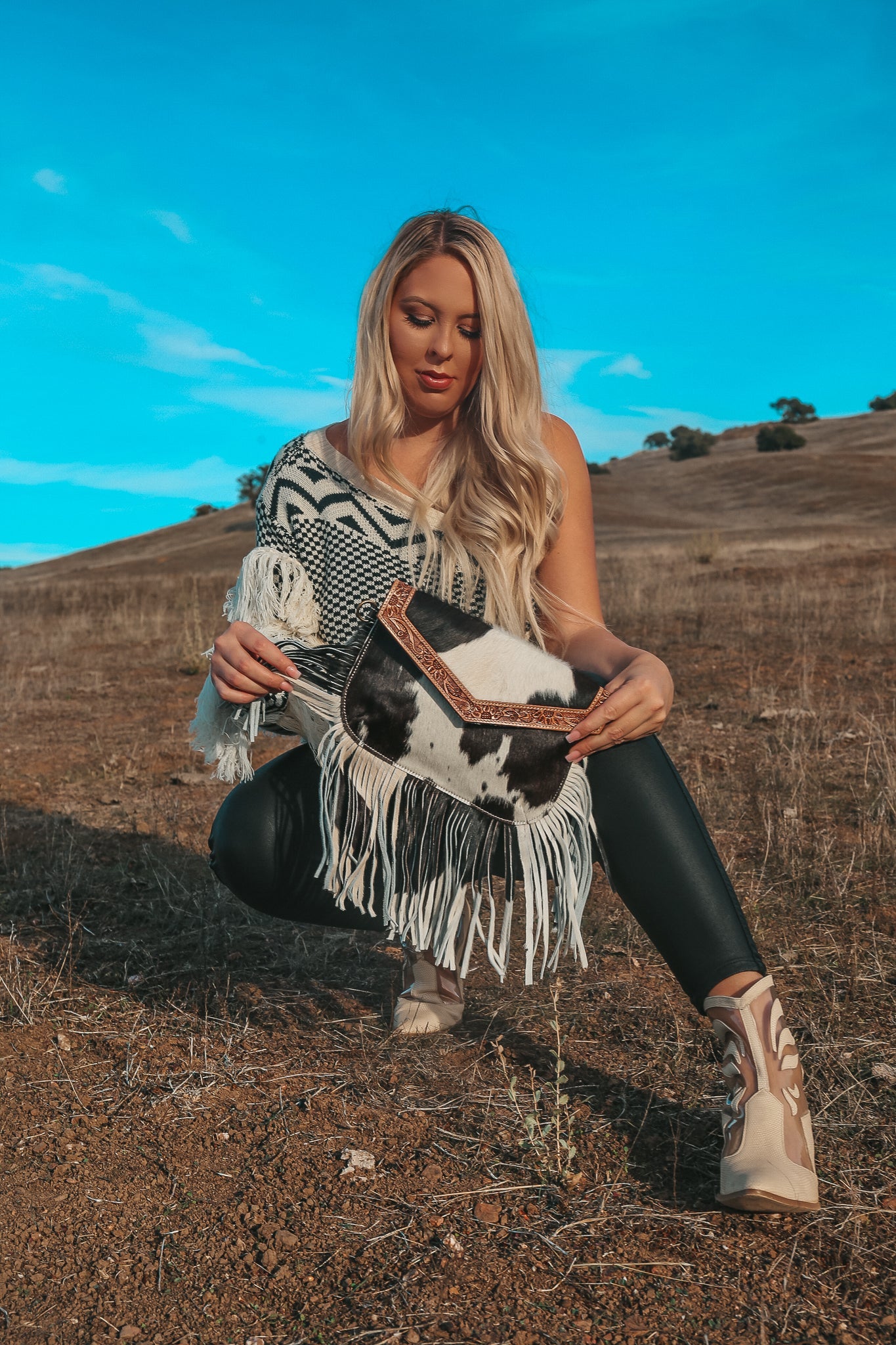 Haute Southern Hyde Maria Cowhide Fringe Purse — lifestyle worn / used context