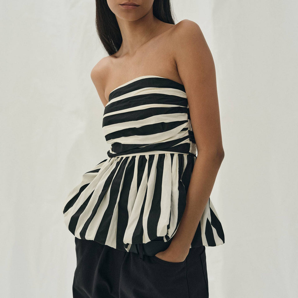 Pretty Little Patriot Pretty Little Patriot Black & White Striped Bubble Tube Top — lifestyle worn / used context