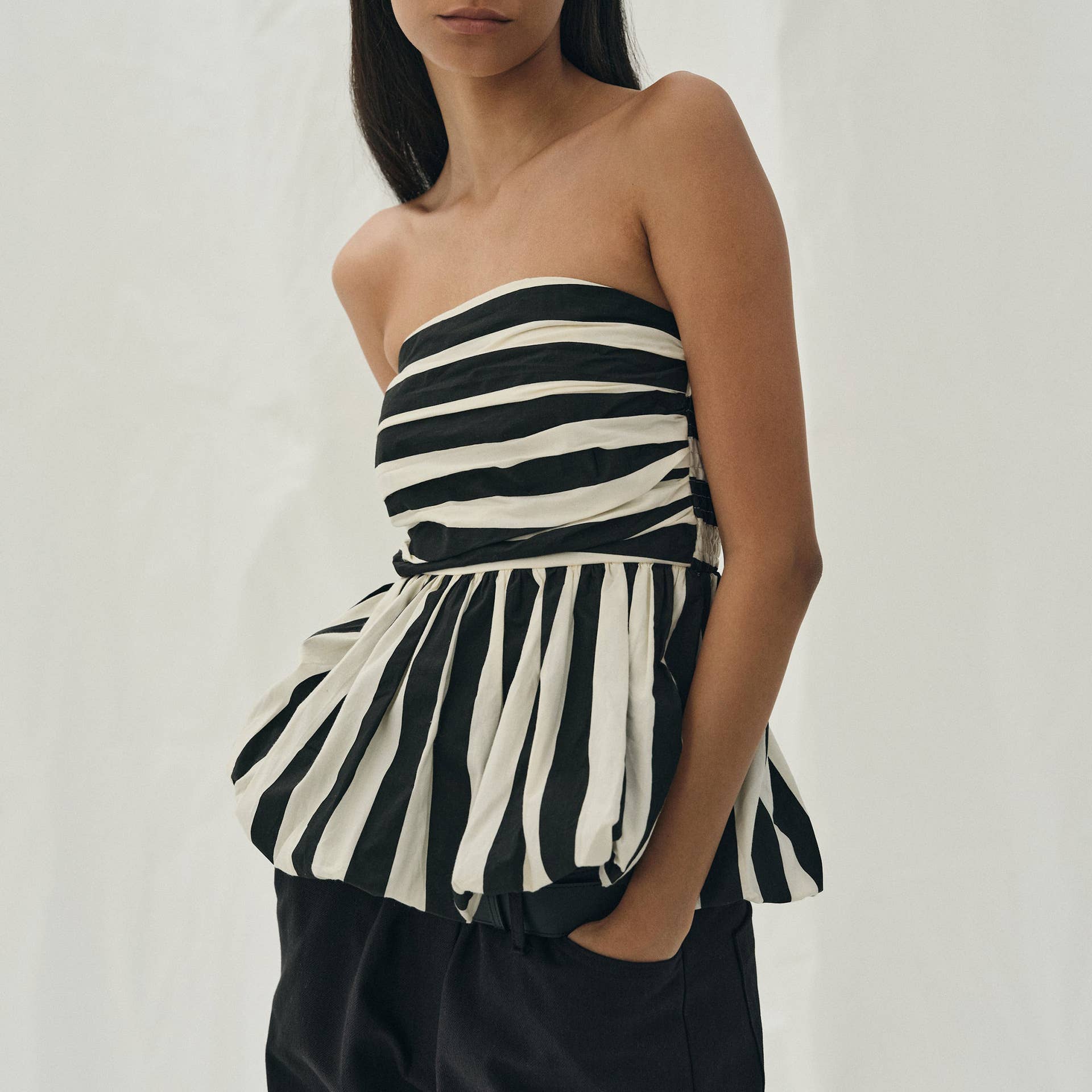 Pretty Little Patriot Pretty Little Patriot Black & White Striped Bubble Tube Top — lifestyle worn / used context