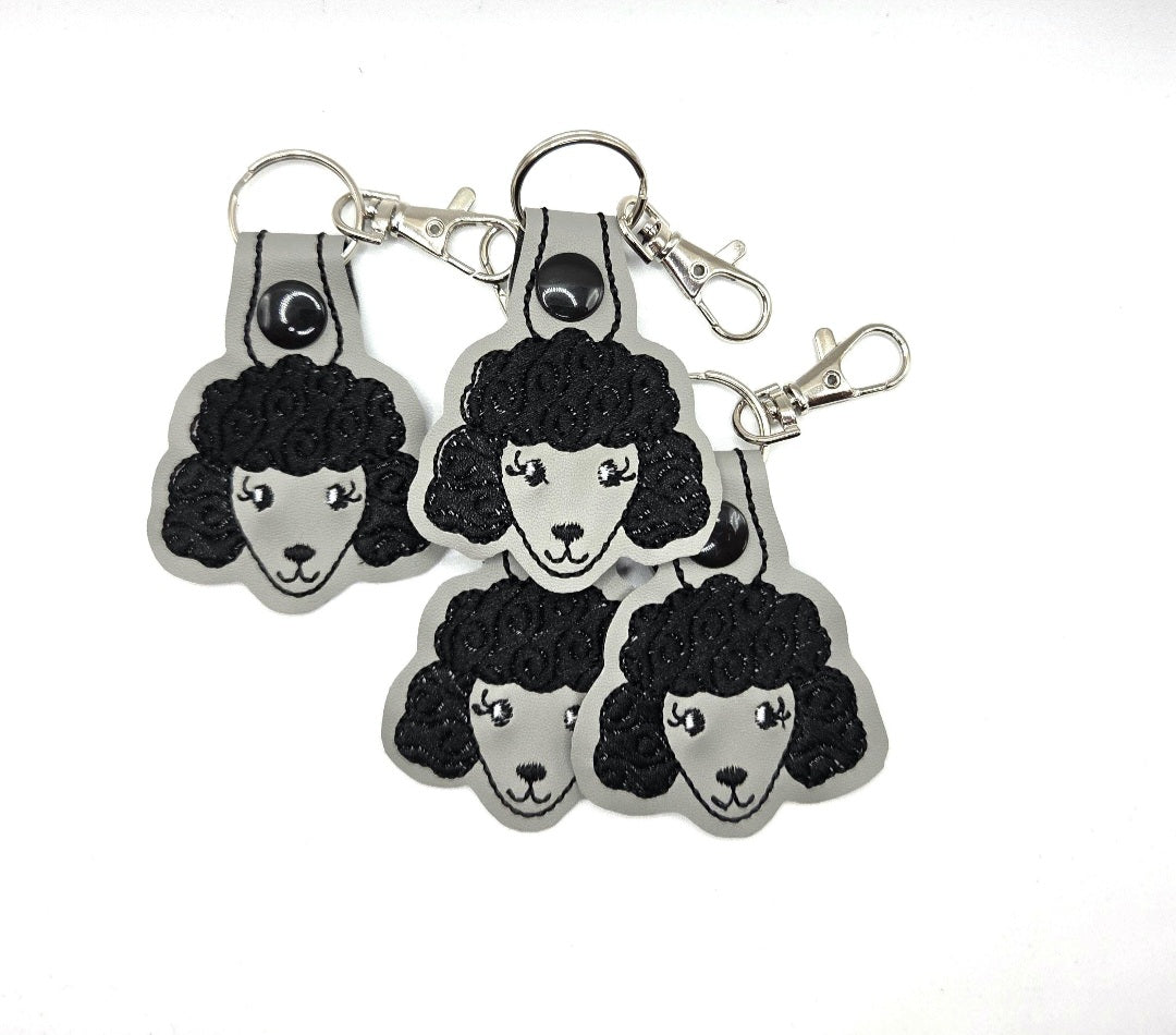 Rewarding Rover LLC One Poodle Head Keychain – Black & Grey or White & Pink Embroidered Snap Tab — image 1