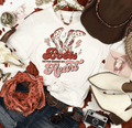A Blessed Texas Mess Boutique Boots Never broke My heart Country Western Shirt Rodeo Wear, Cowgirls, Music… — main product shot