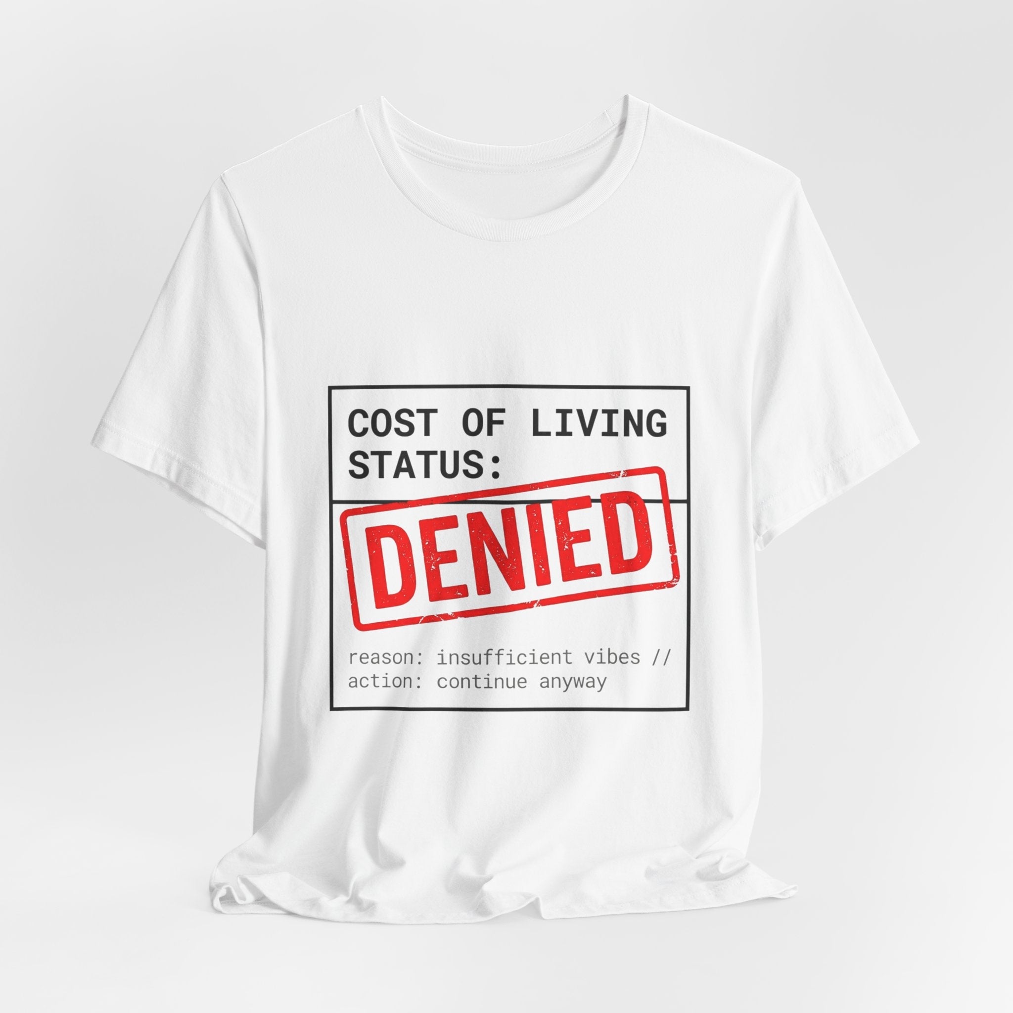 Tristan’s Treehouse Cost of Living Status: DENIED Tee | cost of living crisis, budget humor — packaging