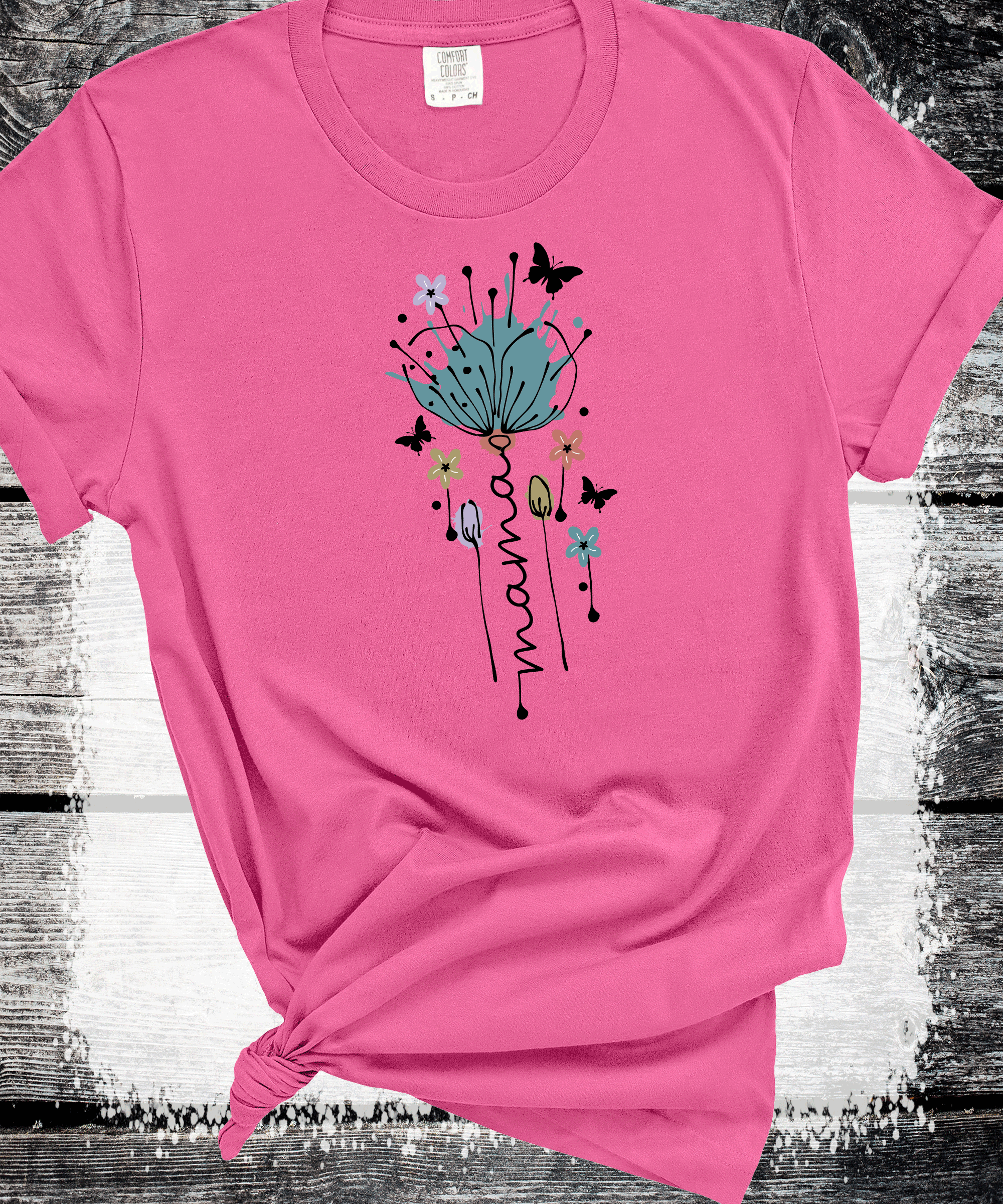 A Blessed Texas Mess Boutique "MAMA in Bloom" Floral Graphic Tees for Beautiful Moms Gift — A Blessed Texas Mess Boutique branding close-up