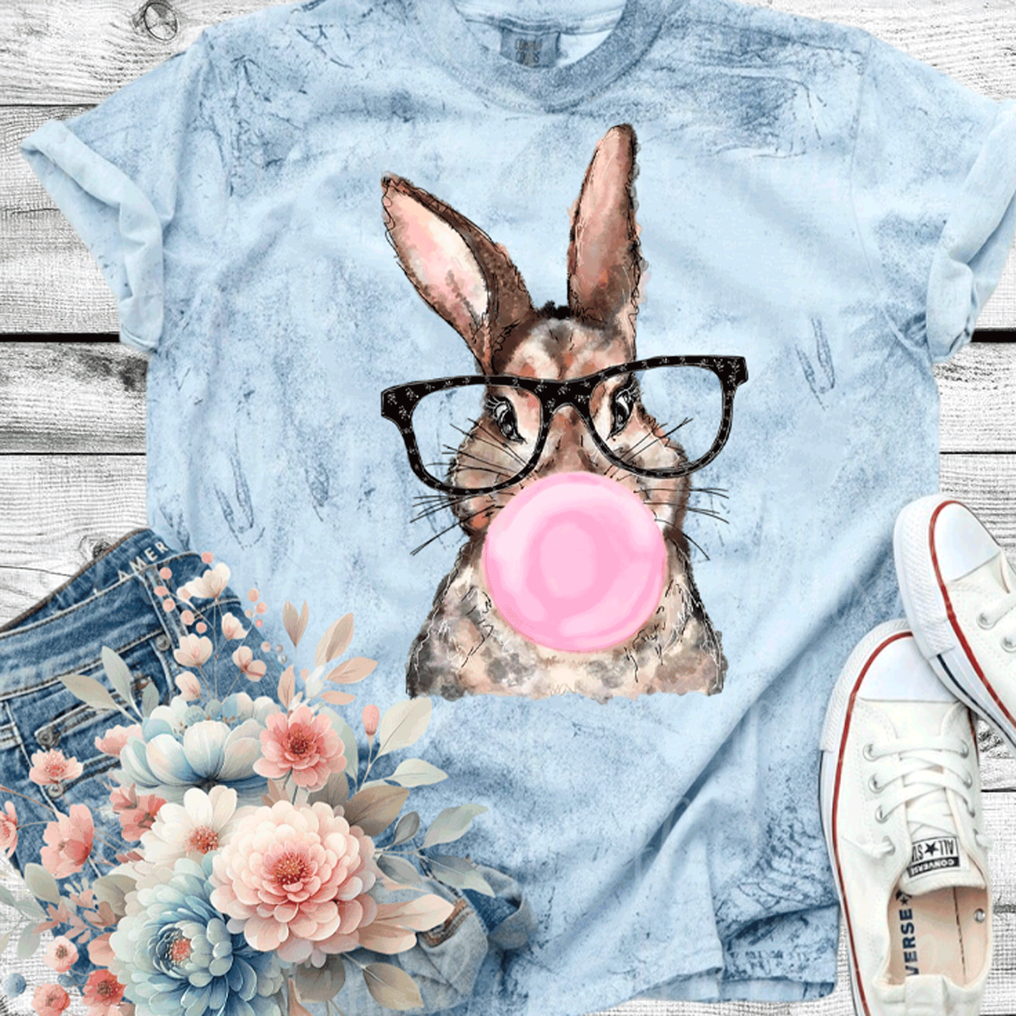 A Blessed Texas Mess Boutique Comfort Color Colorblast Tie Dye Fun Bubble Blowing Bunny — graphic shirts category context