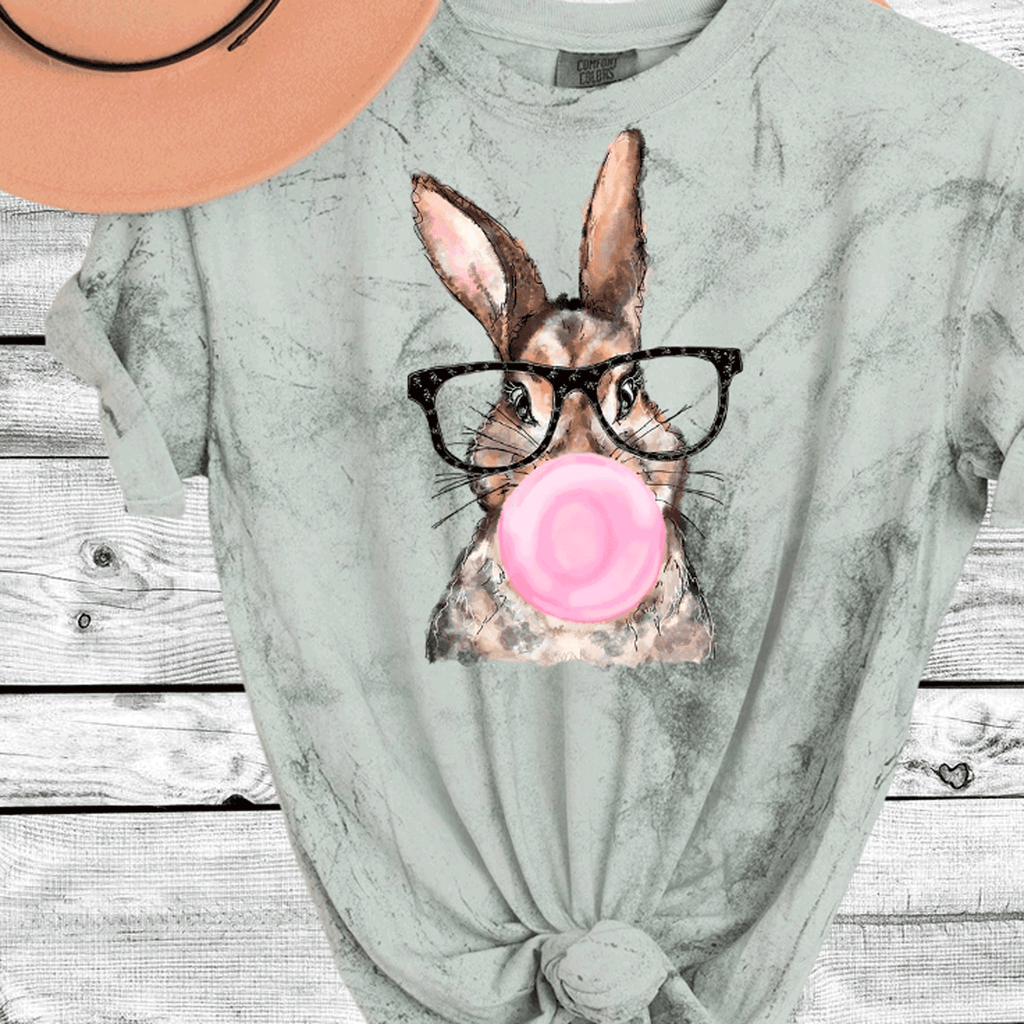 A Blessed Texas Mess Boutique Comfort Color Colorblast Tie Dye Fun Bubble Blowing Bunny — A Blessed Texas Mess Boutique branding close-up