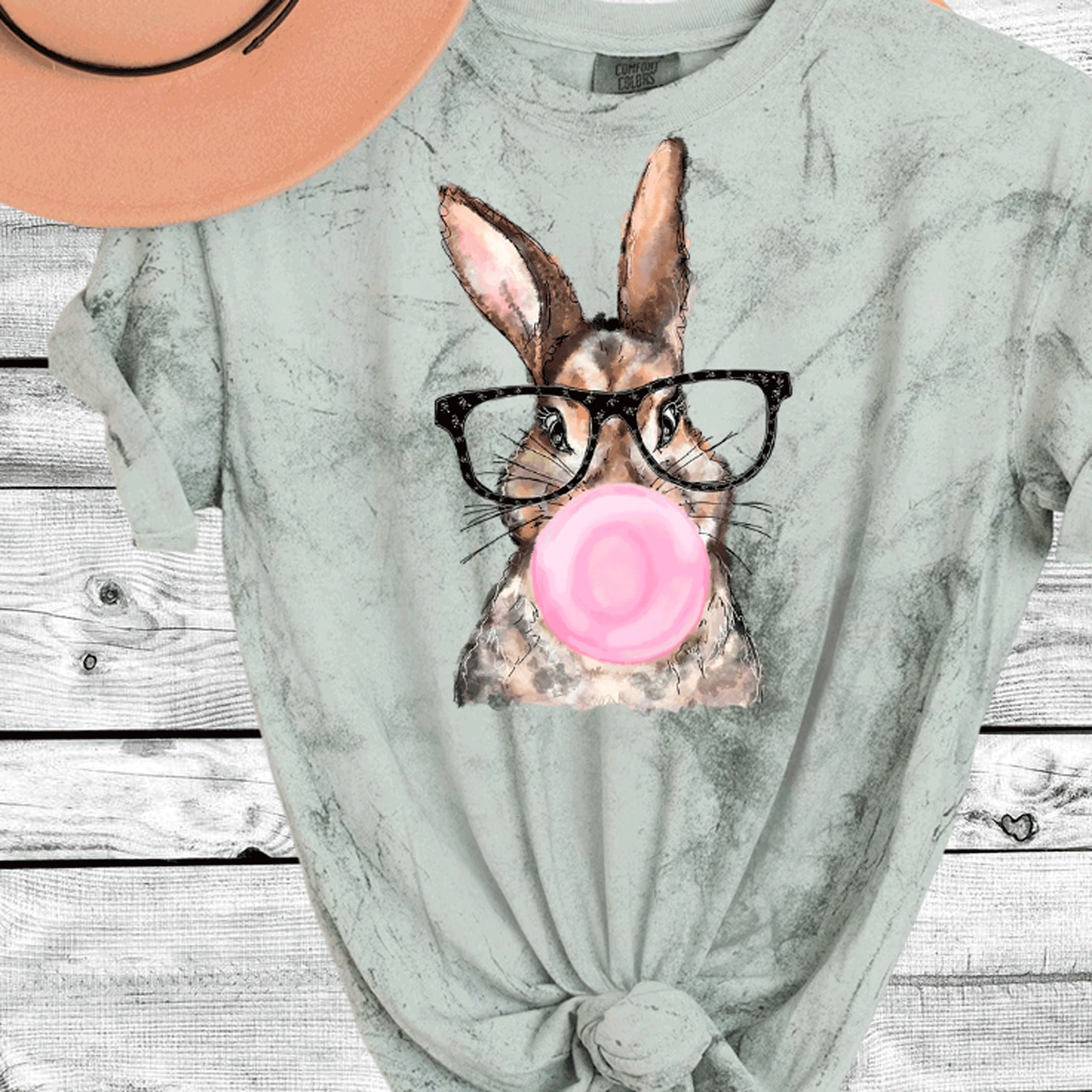 A Blessed Texas Mess Boutique Comfort Color Colorblast Tie Dye Fun Bubble Blowing Bunny — A Blessed Texas Mess Boutique branding close-up