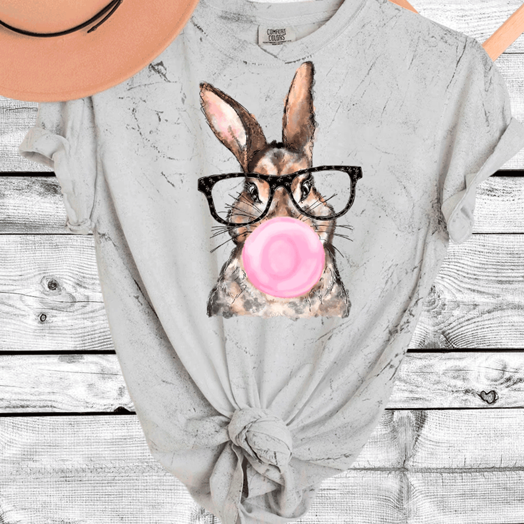 A Blessed Texas Mess Boutique Comfort Color Colorblast Tie Dye Fun Bubble Blowing Bunny — lifestyle worn / used context