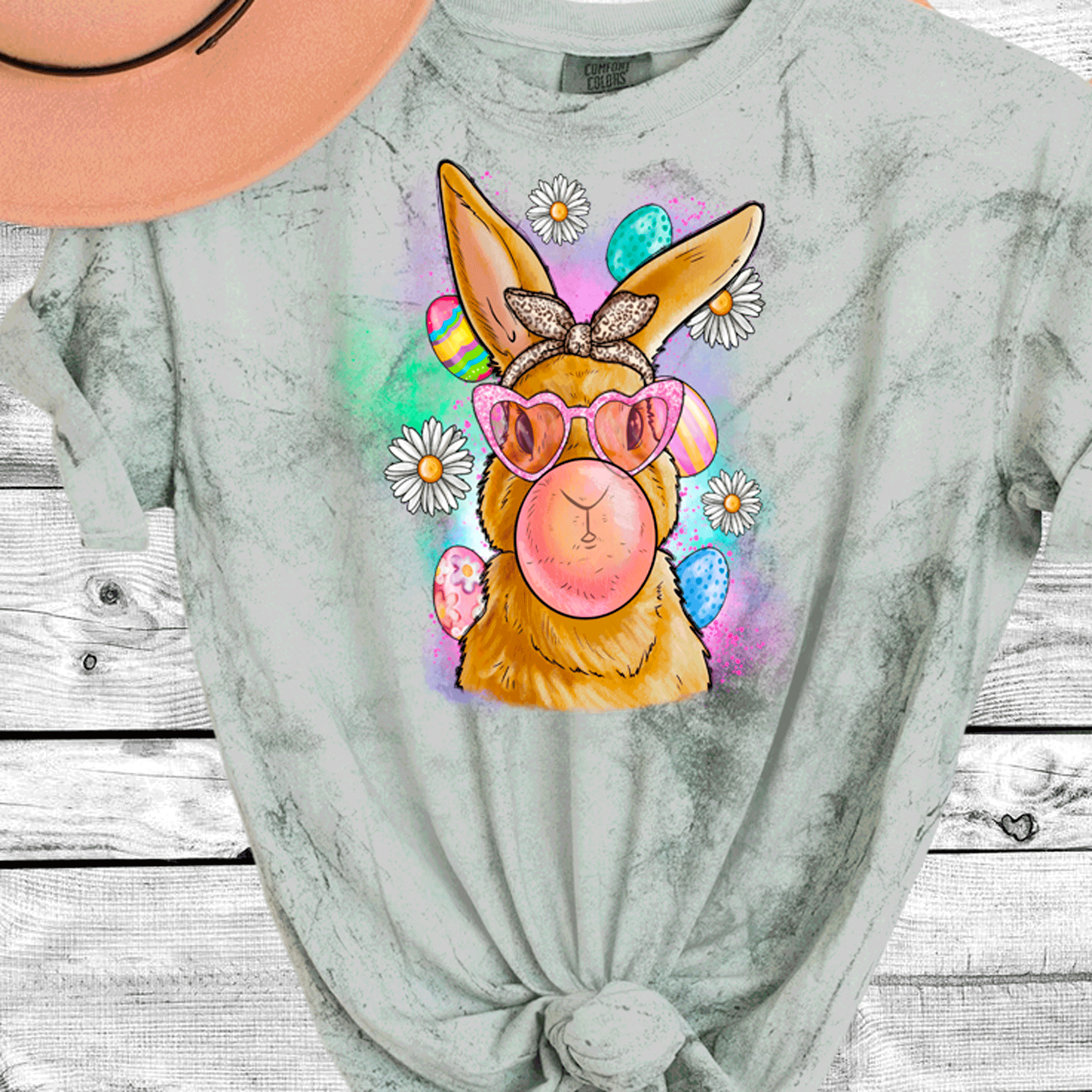 A Blessed Texas Mess Boutique Comfort Color Colorblast Tie Dye Fun Bubble Blowing Bunny — graphic shirts category context