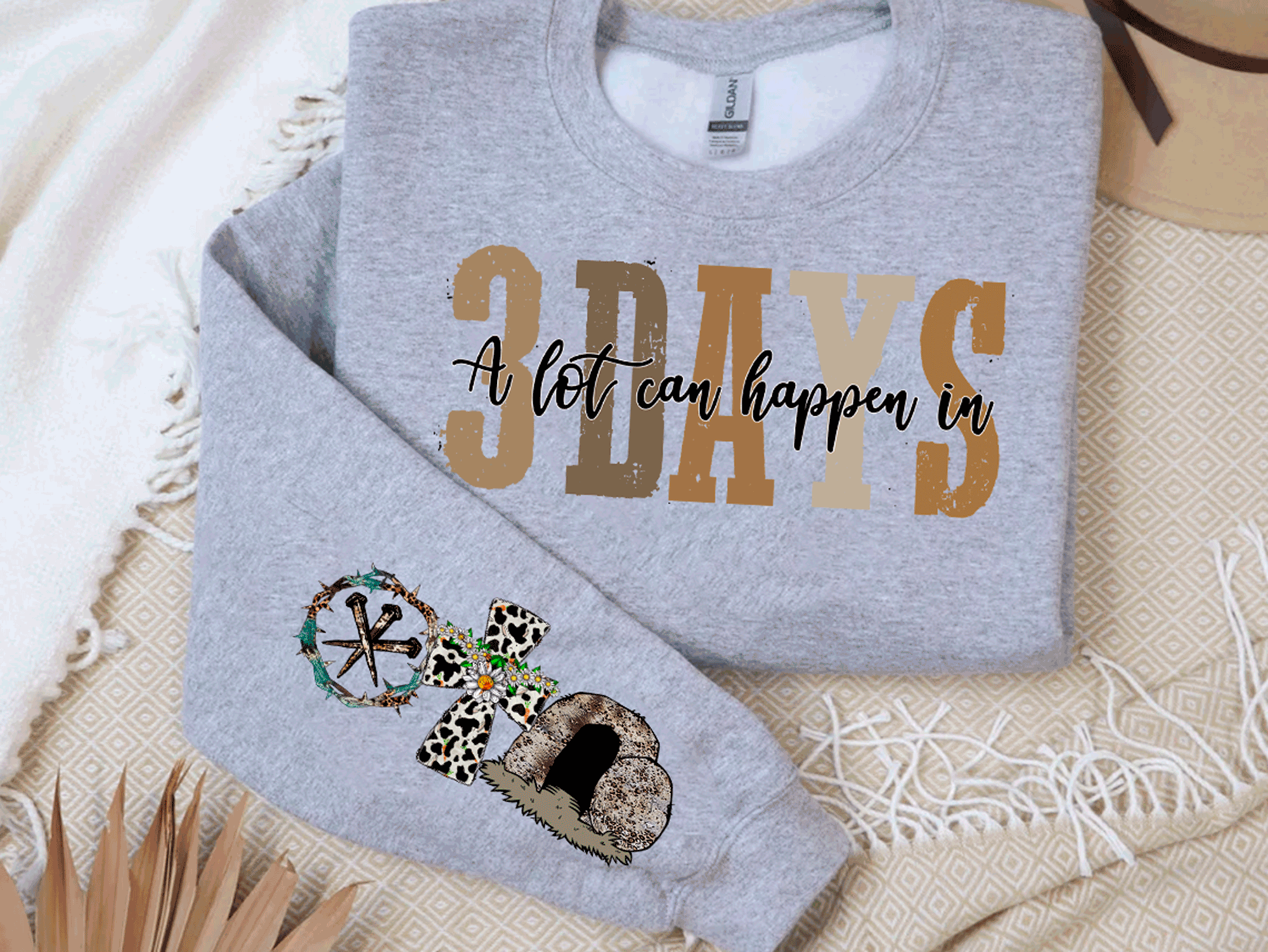 A Blessed Texas Mess Boutique A Blessed Texas Mess Boutique alot can happen in 3 days Easter Sweatshirt — A Blessed Texas Mess Boutique branding close-up