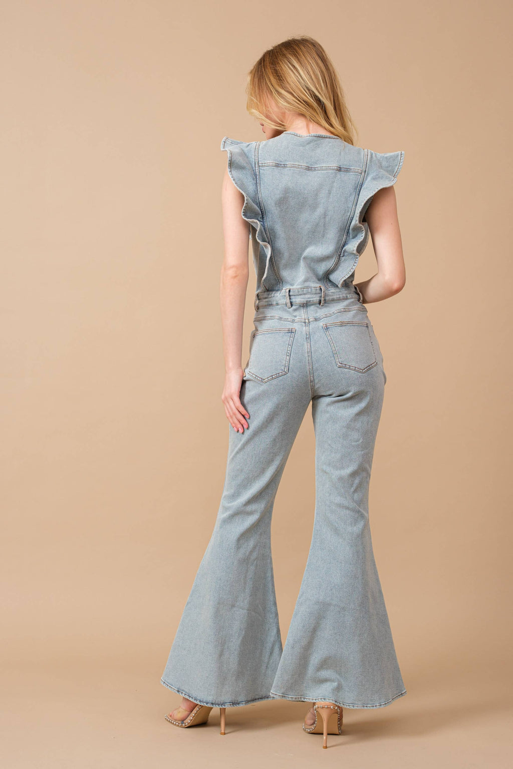 Pretty Little Patriot Pretty Little Patriot Ruffle Bell Bottom Denim Jumpsuit — Pretty Little Patriot branding close-up