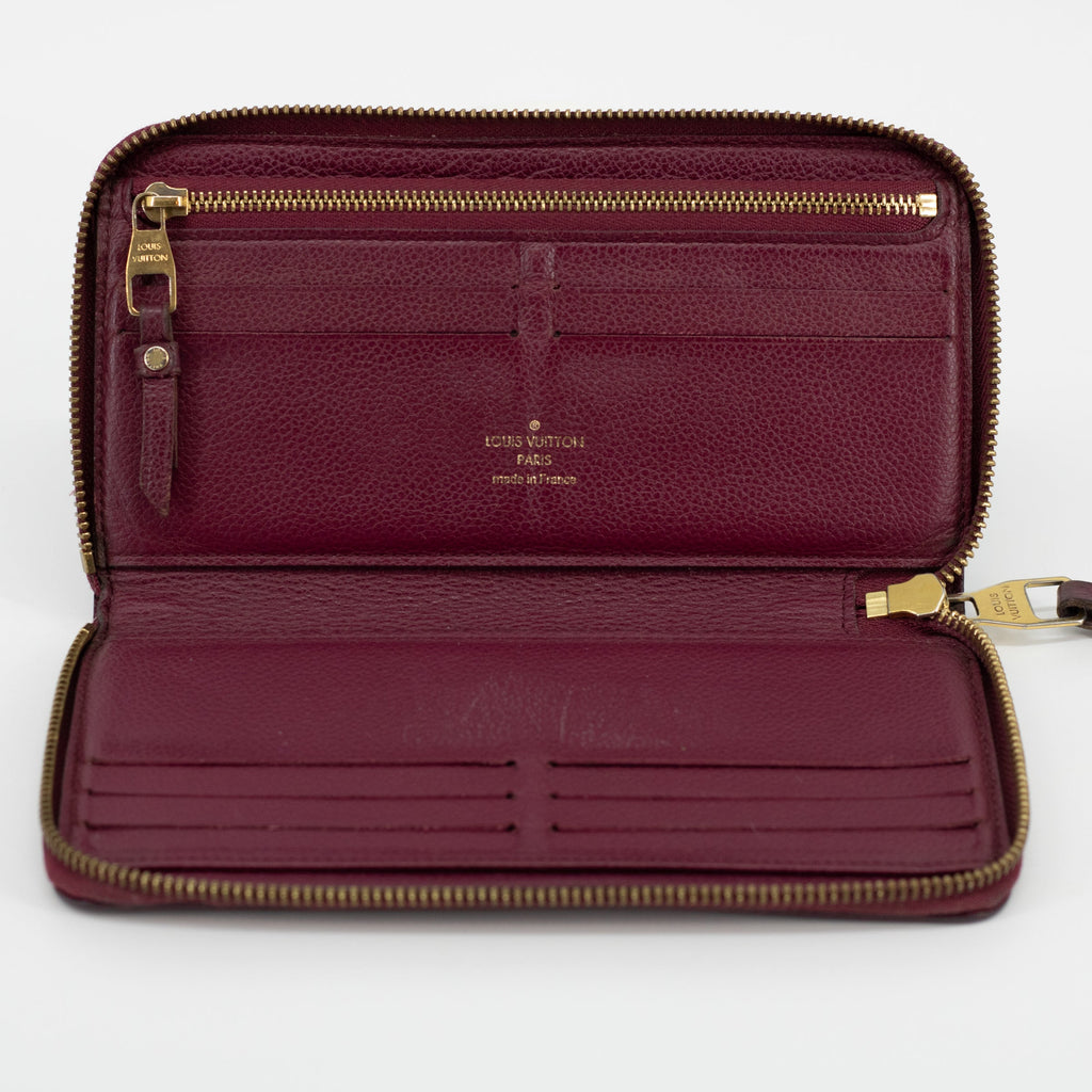 Bolt Boutique Louis Vuitton Empriente Zippy Aurore SP2182 Wallet #1828 — in-use photo