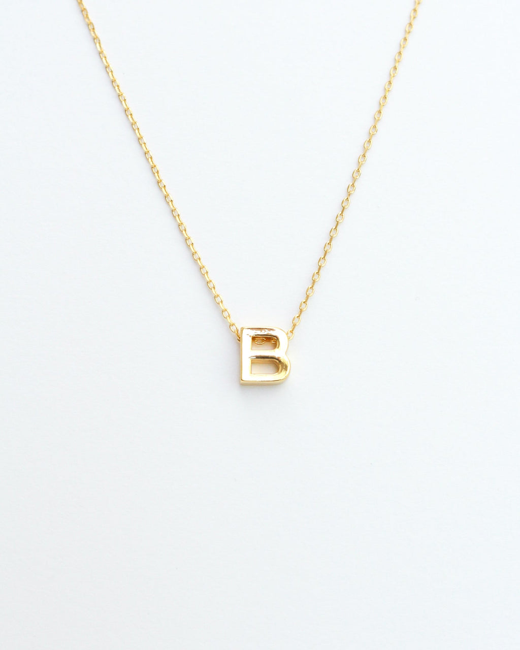KADOU BOUTIQUE Gold Block Letter Initial Necklace — lifestyle context