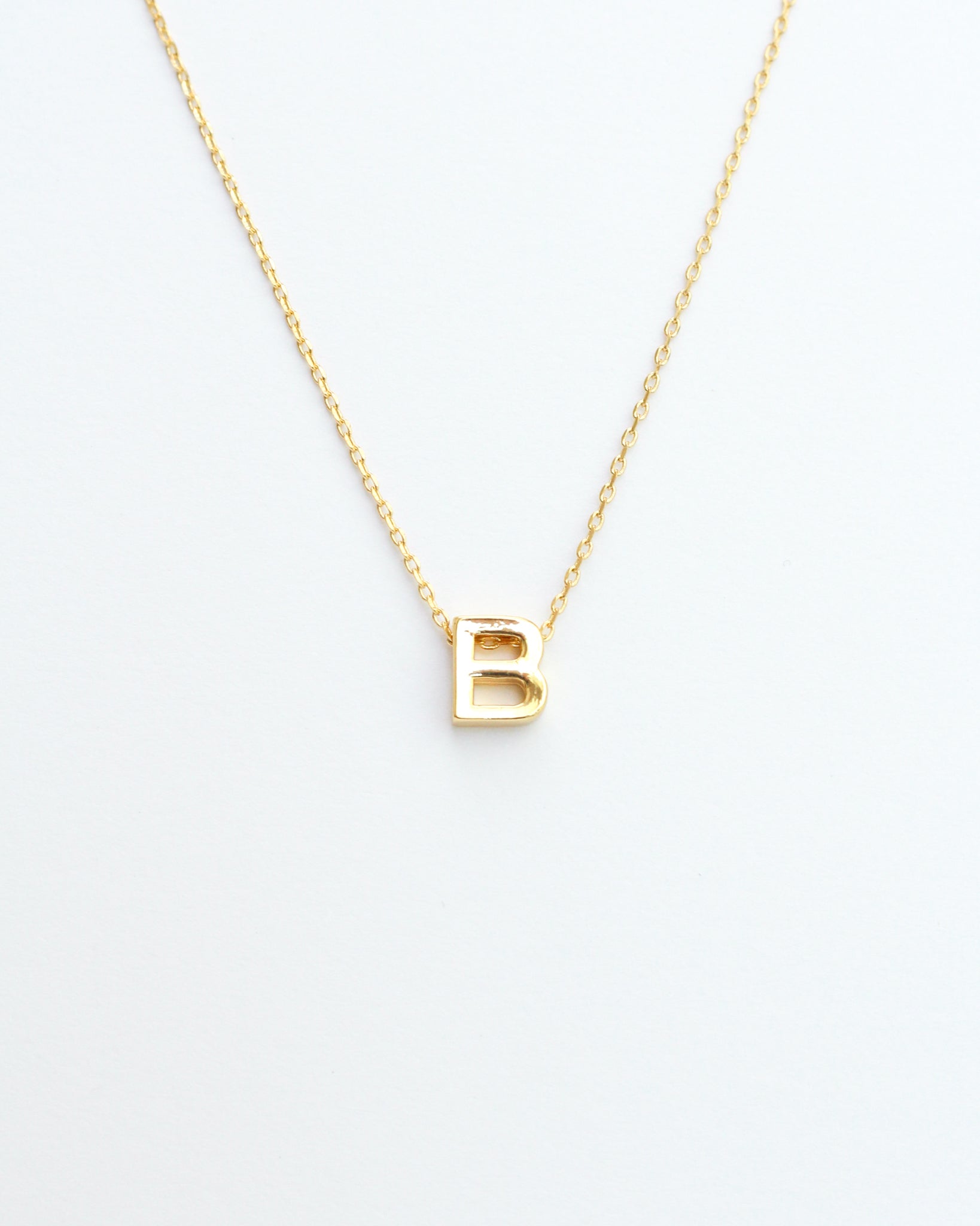 KADOU BOUTIQUE Gold Block Letter Initial Necklace — lifestyle context