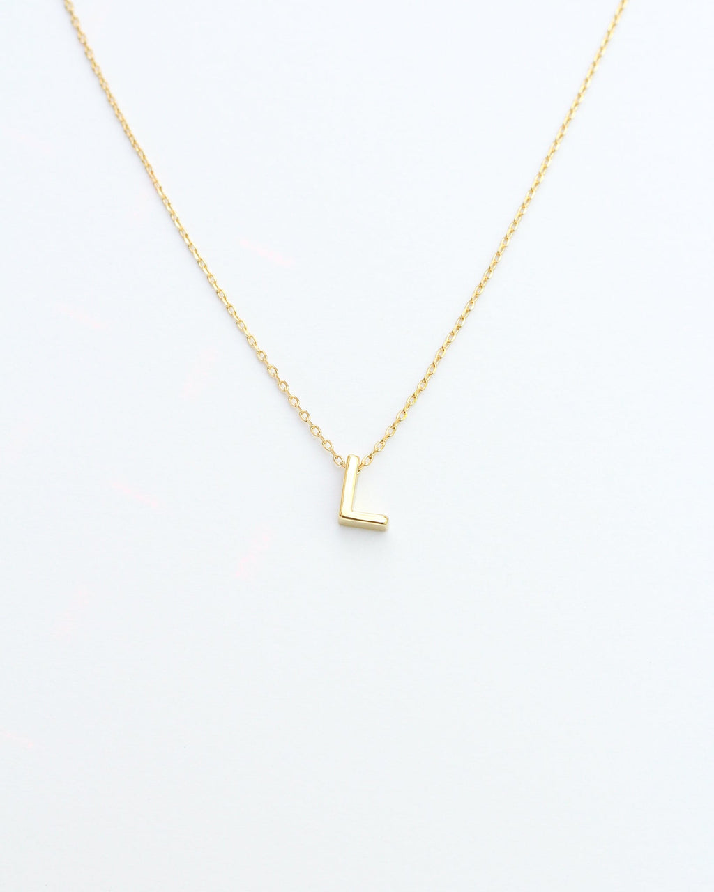 KADOU BOUTIQUE Gold Block Letter Initial Necklace — fabric or material detail