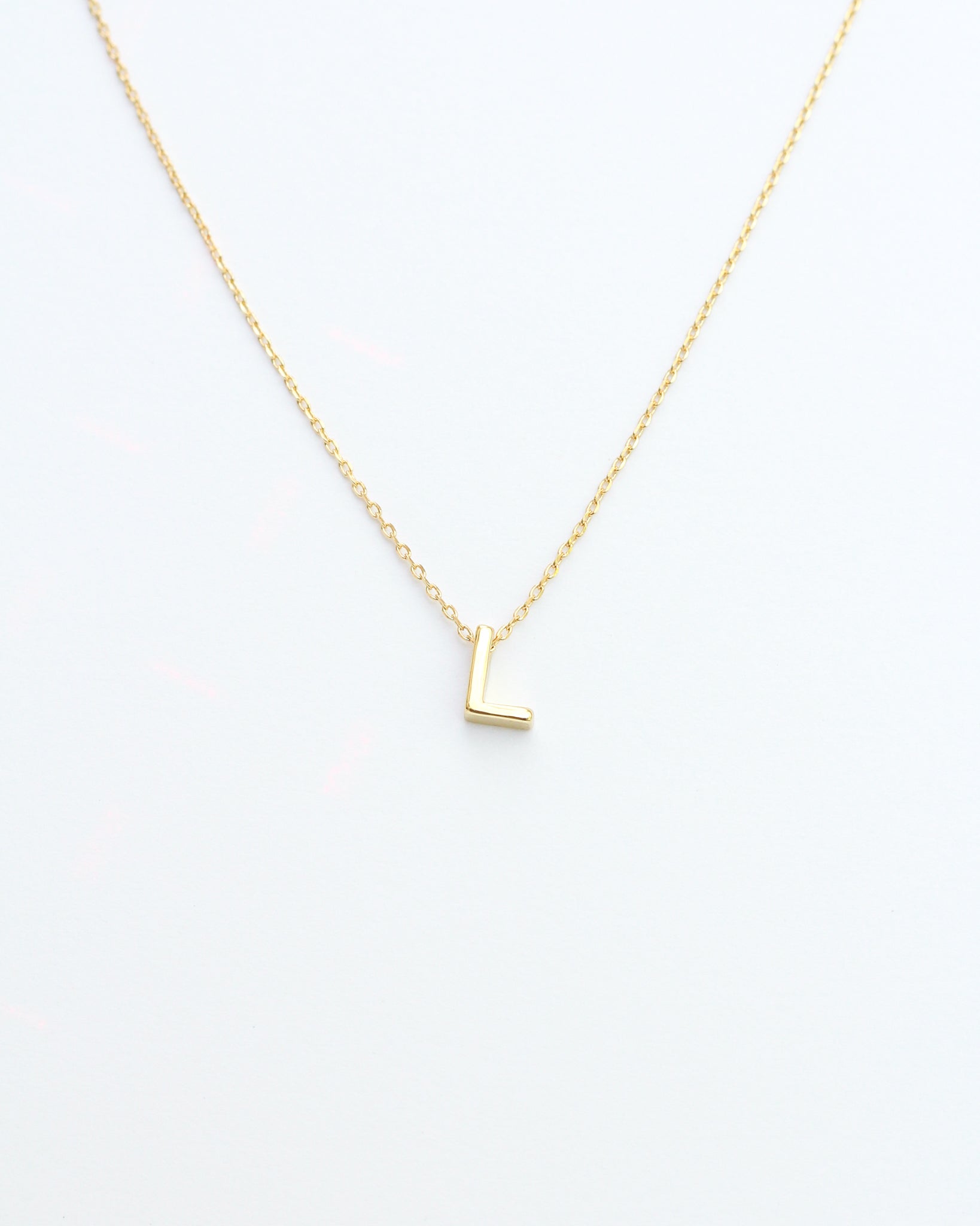 KADOU BOUTIQUE Gold Block Letter Initial Necklace — fabric or material detail