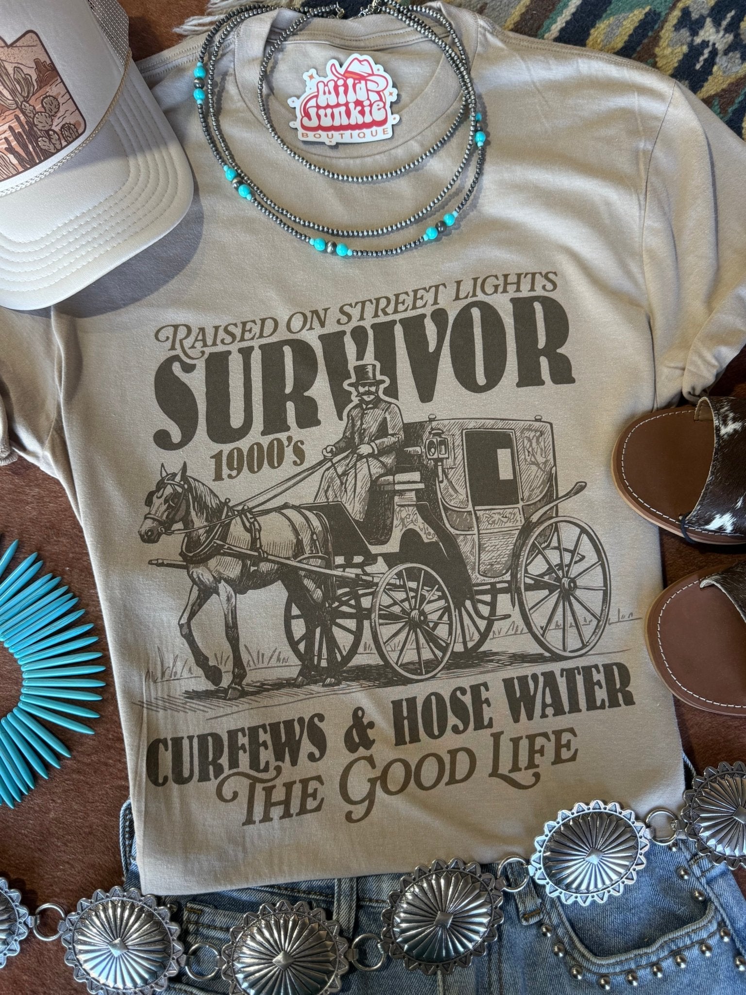 Wild Junkie 1900's Survivor Graphic Tee — Wild Junkie branding close-up