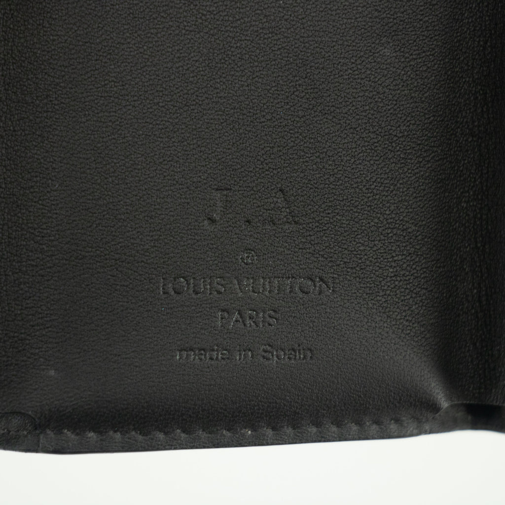 Bolt Boutique Louis Vuitton Monogram Eclipse Discovery Compact Wallet #1958 — in-use photo