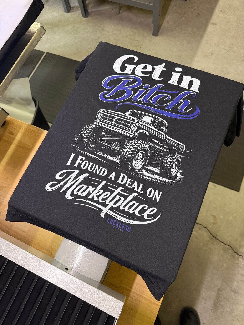 Luckless Outfitters Deal on Marketplace Tee — detail close-up