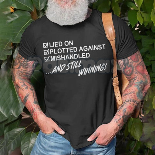 "Still Winning" Resilience T-Shirt - Lied On Plotted Against Mishandled Graphic Tee, Inspirational Survival Quote Shirt, Motivational Hustle Apparel, Premium Heavyweight Unisex Success Top, Overcomer Statement Shirt