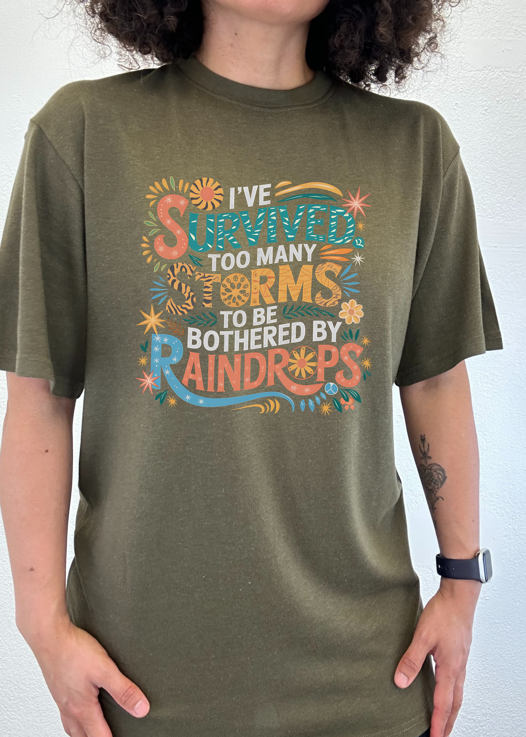 Spun Bamboo I've Survived Too Many Storms to Be Both Unisex Bamboo/Cotton Graphic T-Shirt — detail close-up