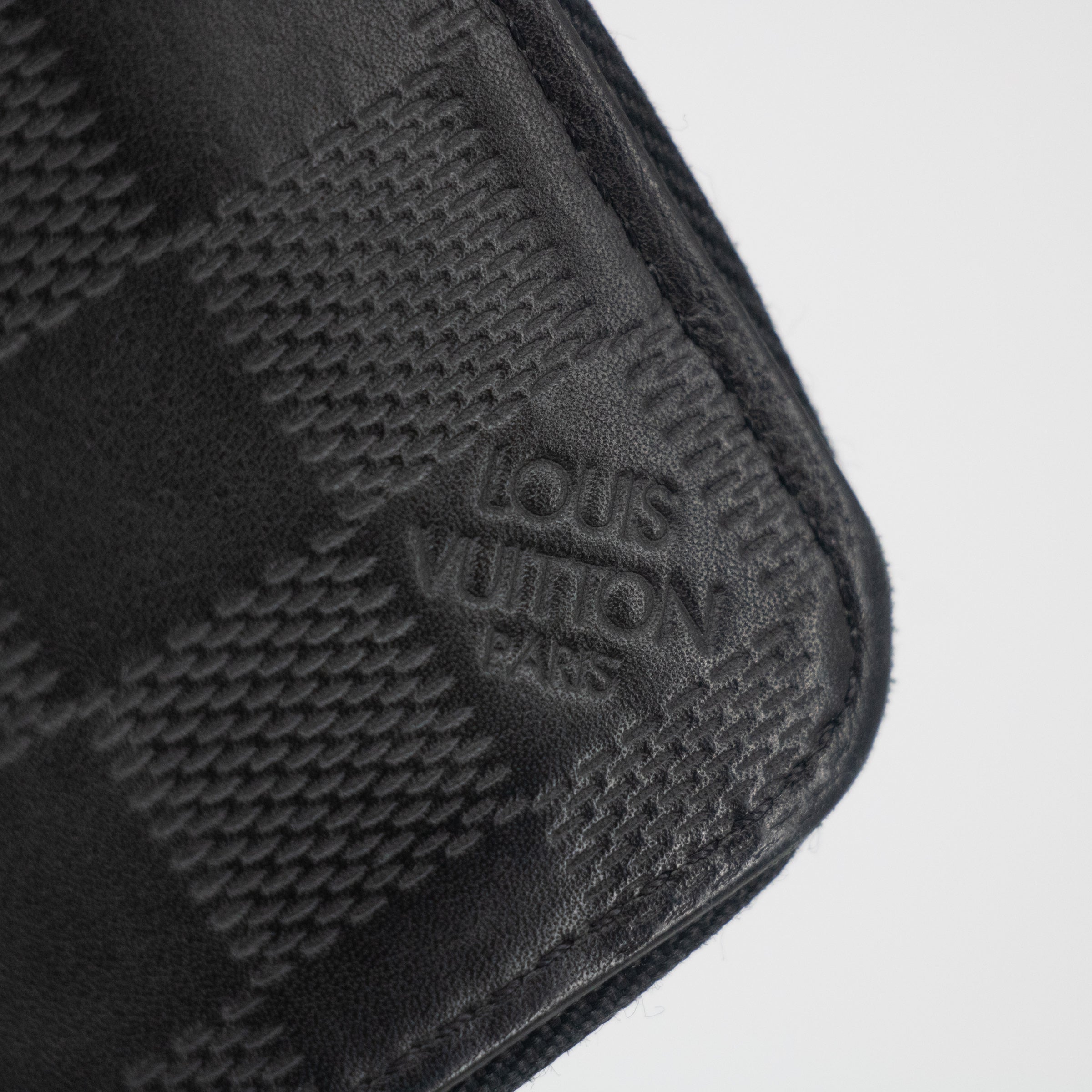 Bolt Boutique Louis Vuitton Black Damier Infini Vertical Zippy Wallet #2267 — side view
