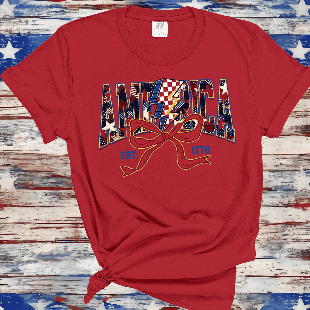 A Blessed Texas Mess Boutique America Est 1776, Checkered Lightning Bolt, 4th of july Coquette Bow Land of… — A Blessed Texas Mess Boutique branding close-up