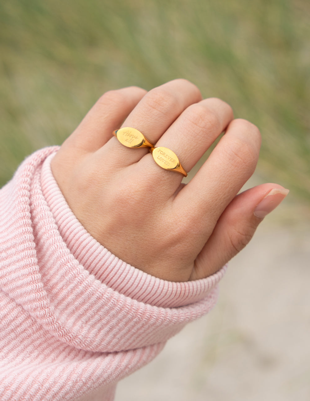 Elevated Faith Forever Loved Oval Signet Ring — lifestyle context