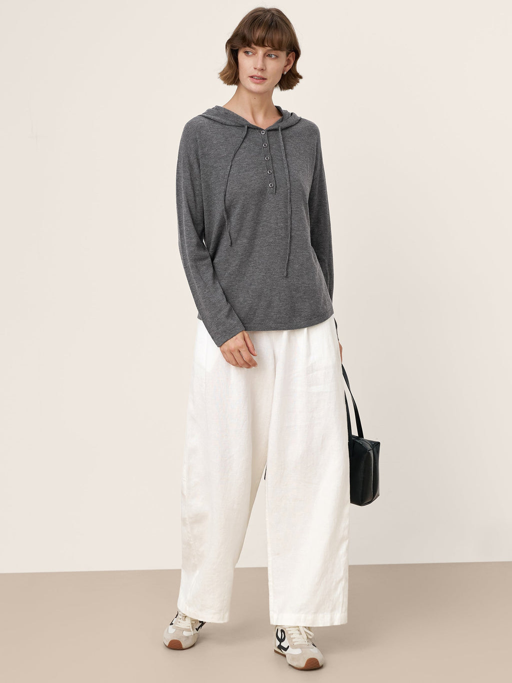 LINTICO 100% Extra-Fine Merino Wool Knit Hooded Sweatshirt SIA — LINTICO branding close-up