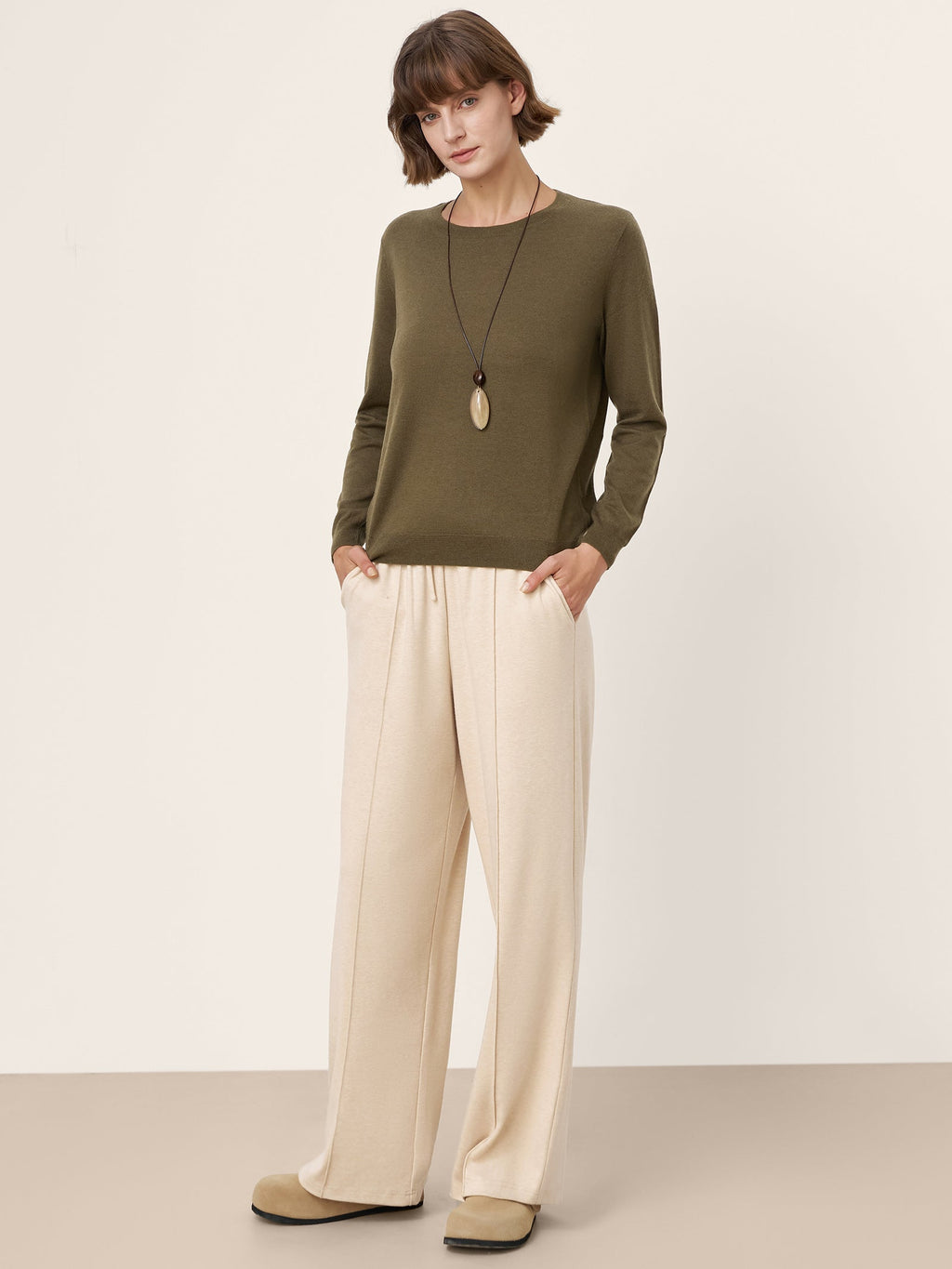 LINTICO 100% Extra-Fine Merino Wool Essential Crew Neck Knit Sweater BRIDGET — LINTICO branding close-up