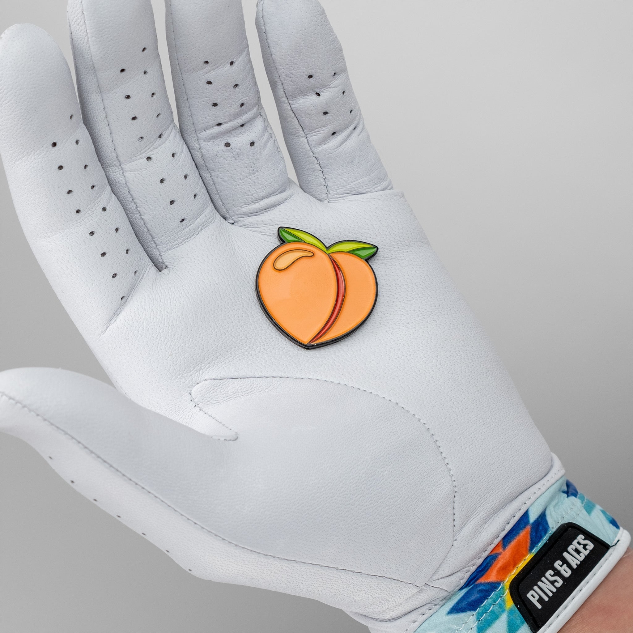 Pins and Aces Peach Ball Marker — side view