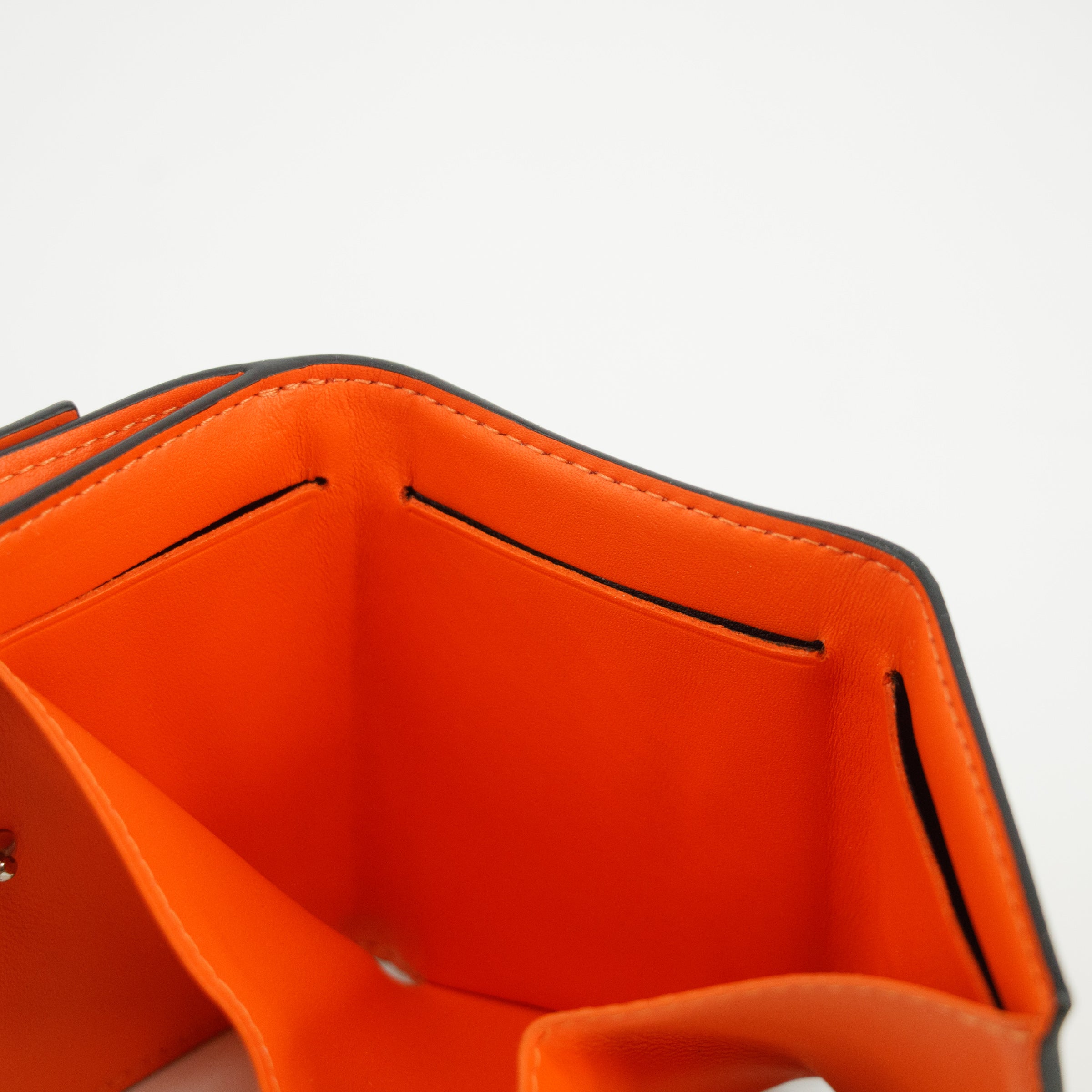 Bolt Boutique Louis Vuitton Orange Taigarama Discovery Compact Mini Wallet #2952 — in-use photo