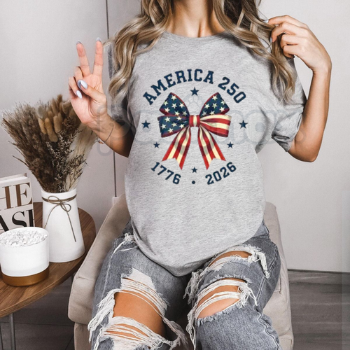America 250 "Stars and Stripes" Bow T-Shirt – 2026 Semiquincentennial Graphic Tee, Premium 100% Cotton Patriotic Coquette Top, Soft Lived-In Heavyweight USA 250th Anniversary Shirt, Made in USA