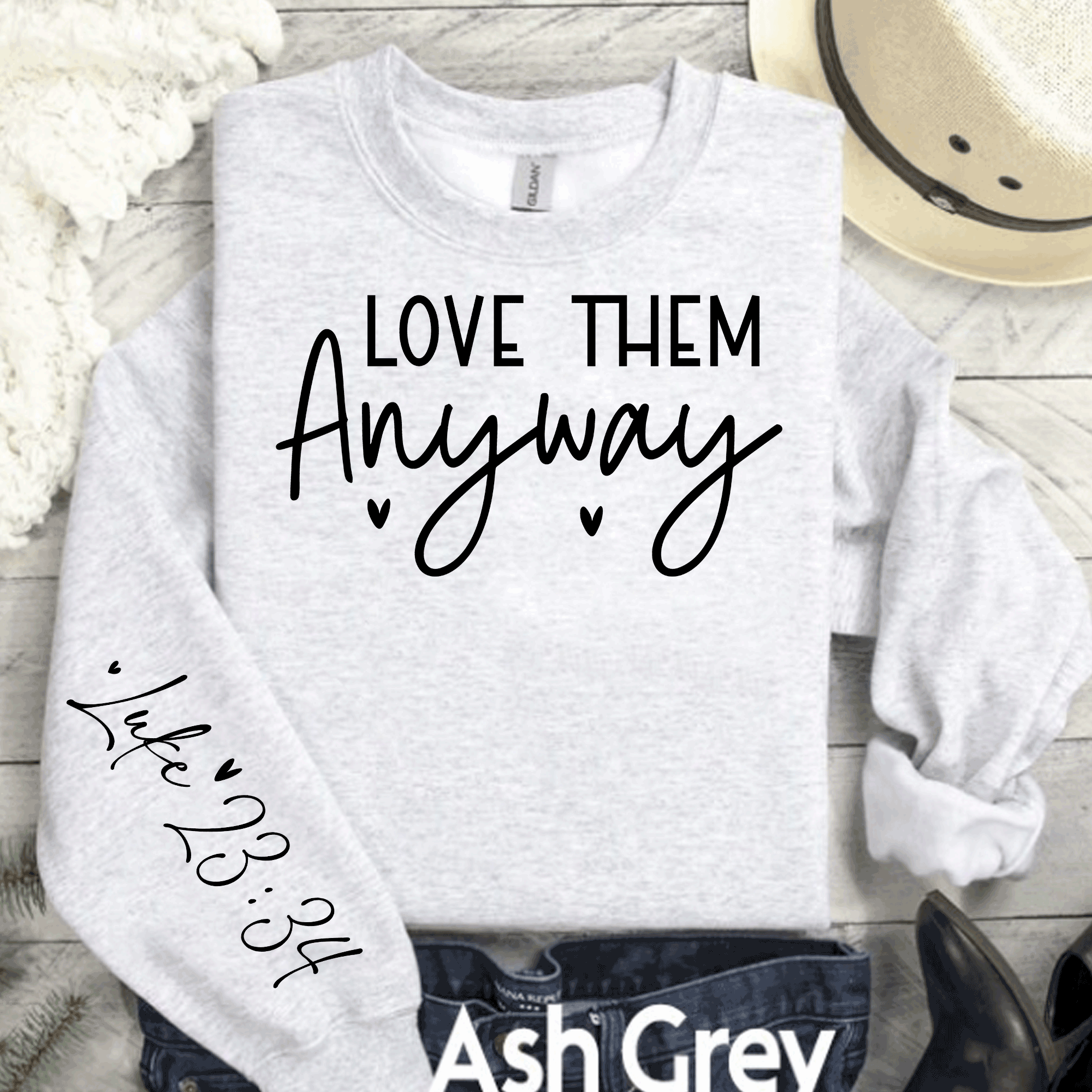 A Blessed Texas Mess Boutique Love Them Anyway Sweatshirt, Christian Luke 23:34 Sweatshirt, Kindness… — A Blessed Texas Mess Boutique branding close-up