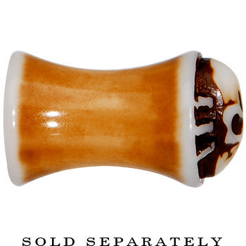 BodyCandy 2G Brown White Resin Skull Saddle Plug — lifestyle context