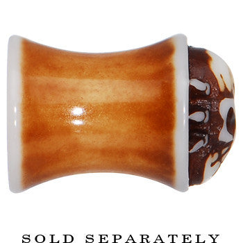 BodyCandy 0G Brown White Resin Skull Saddle Plug — lifestyle context
