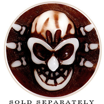BodyCandy 9/16 Brown White Resin Skull Saddle Plug — detail close-up