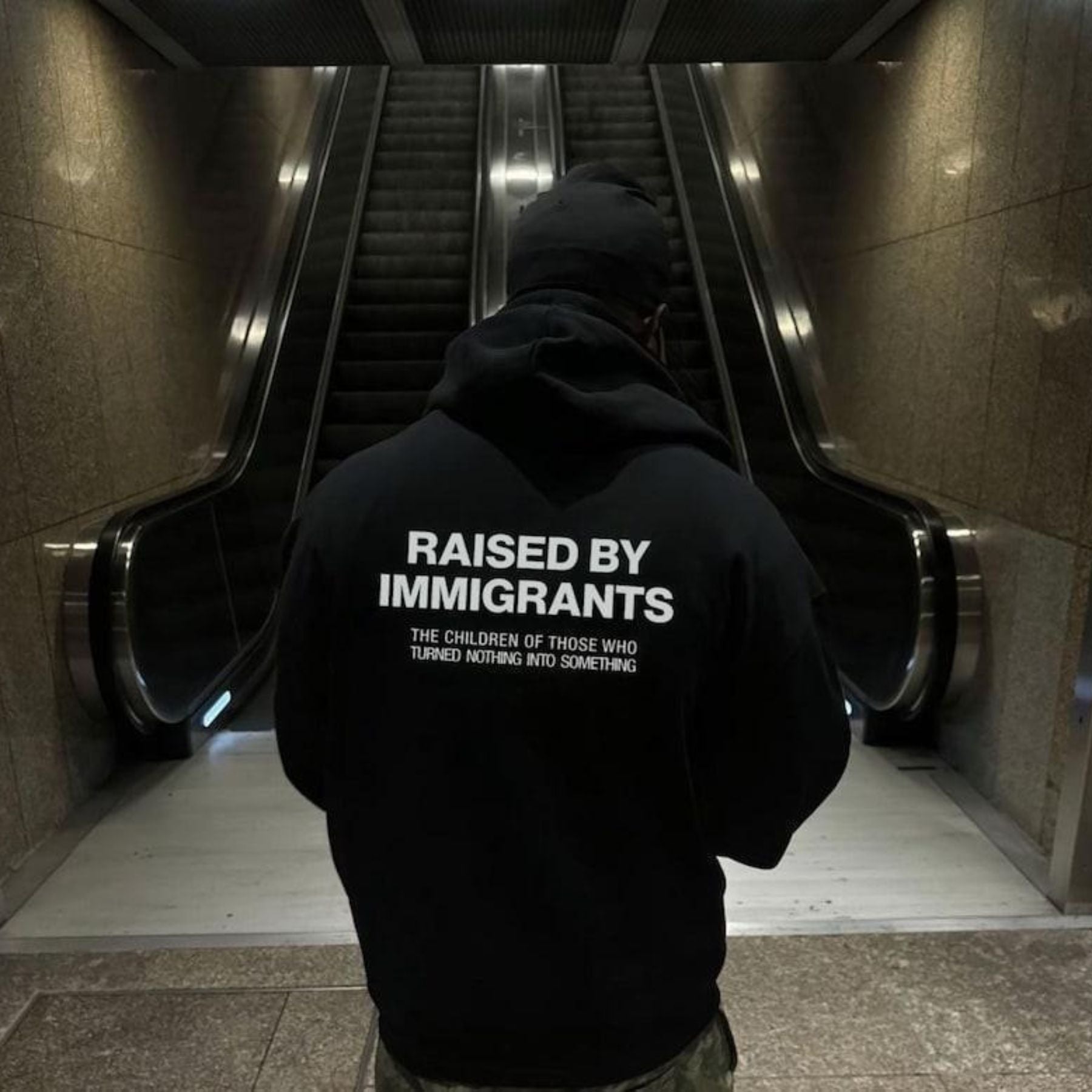 Pasimax Raised By Immigrants Hoodie — lifestyle context
