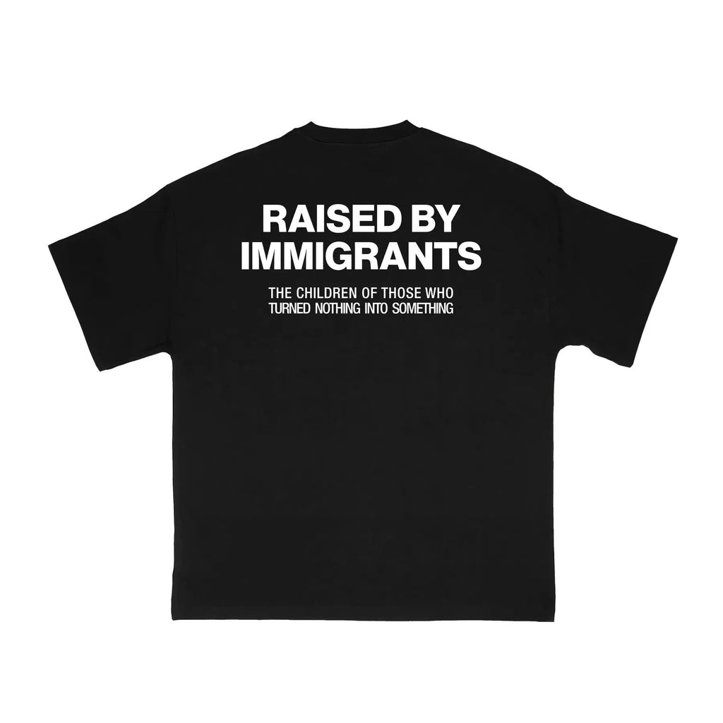 Pasimax "Raised by Immigrants" Statement Tee — lifestyle context