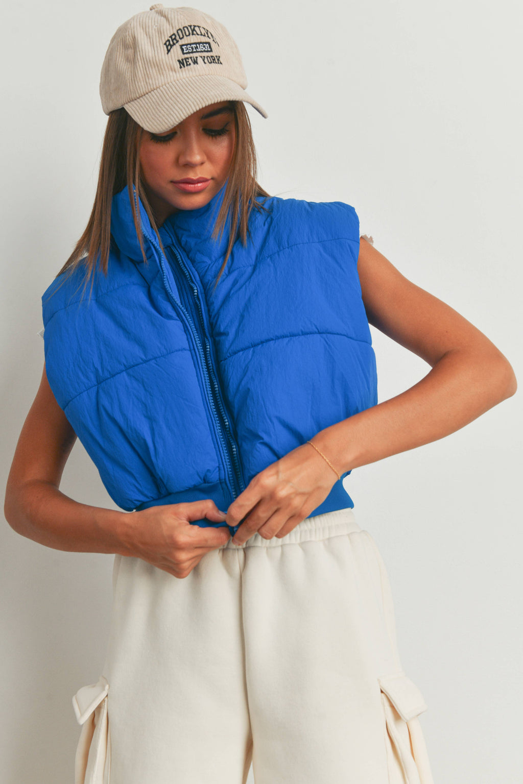 Pretty Little Patriot Pretty Little Patriot Royal Blue Crop Puffer Vest — lifestyle worn / used context