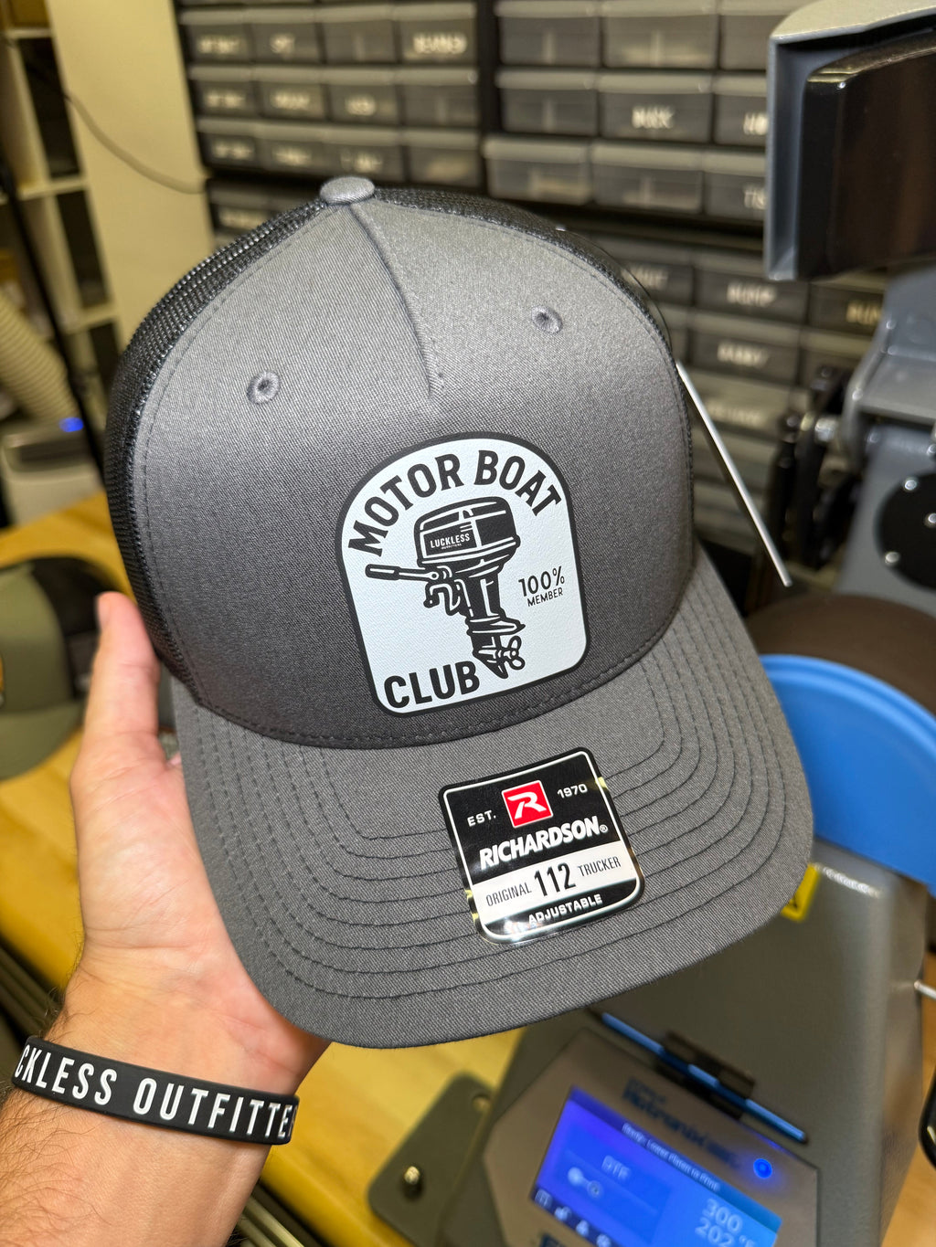 Luckless Outfitters Motor Boat Club Trucker Hat — lifestyle context