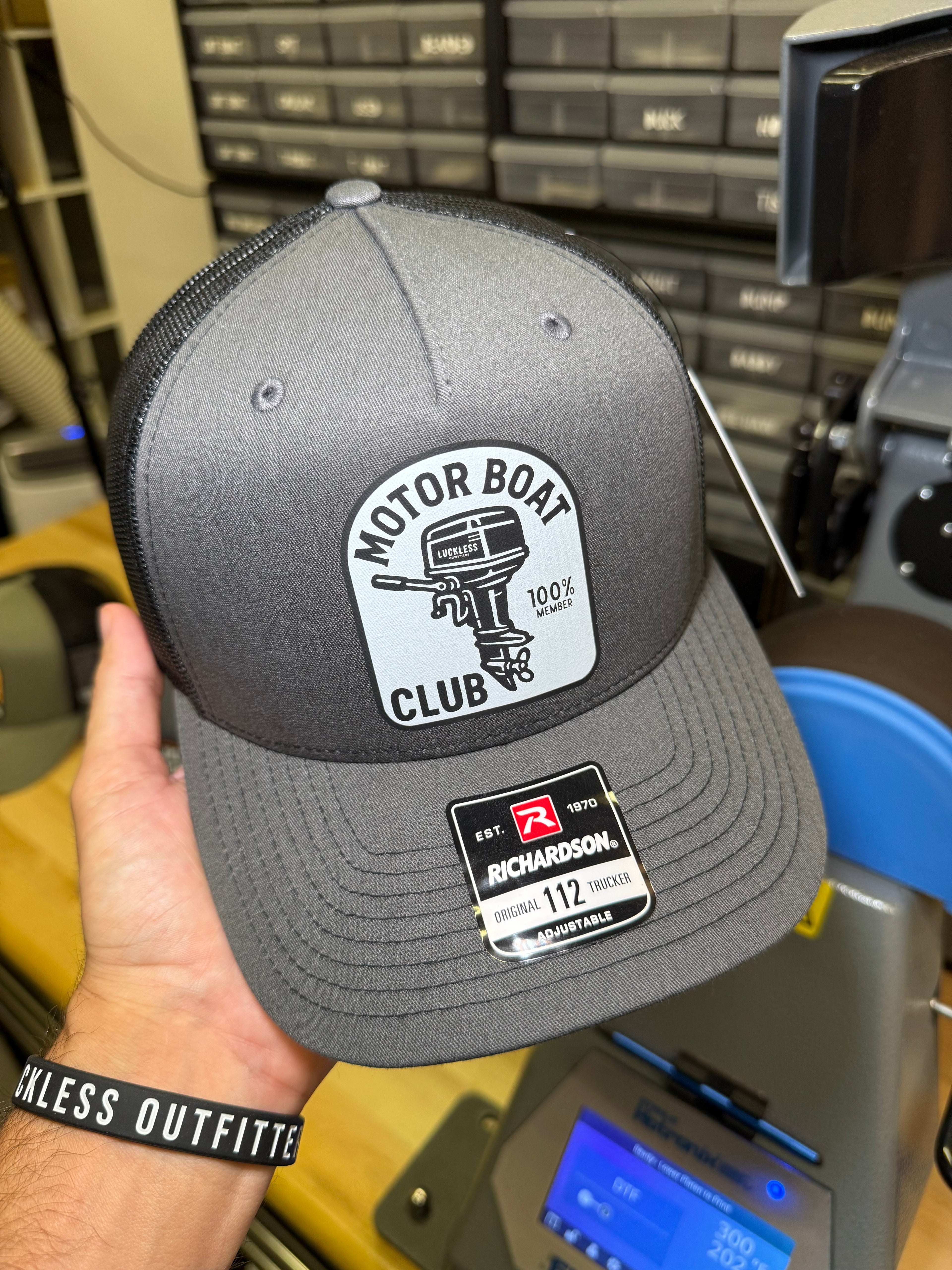 Luckless Outfitters Motor Boat Club Trucker Hat — lifestyle context