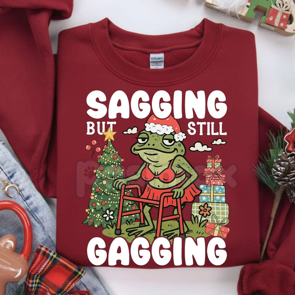 Pasimax "Sagging But Still Gagging" Funny Christmas Meme Frog Sweatshirt – Sarcastic Holiday Crewneck — side view