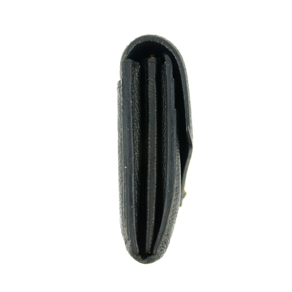 Bolt Boutique Louis Vuitton Monogram Empreinte Portefeuille Black Leather Wallet #5297 — lifestyle context