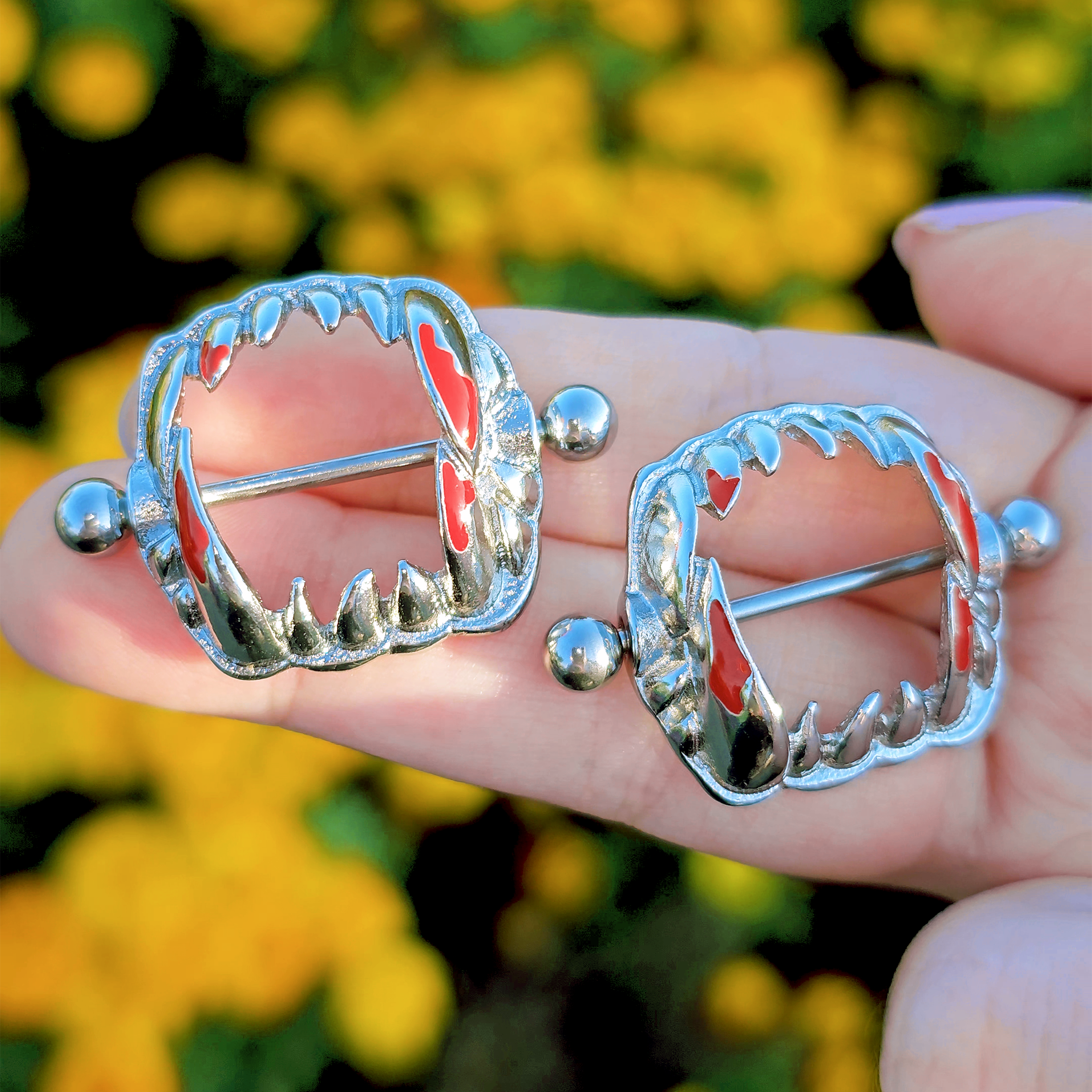 BodyCandy 14G 1 1/8 Steel Dripping Red Vampire Fangs Barbell Nipple Shield Set — lifestyle context